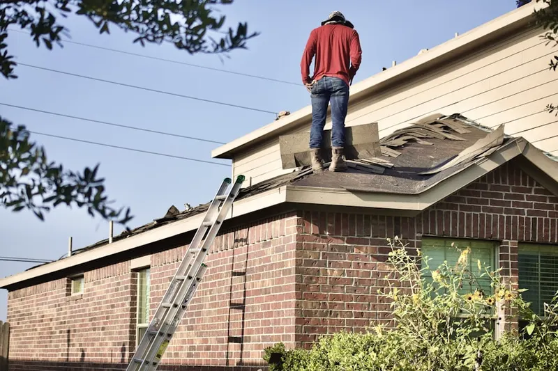 Professional roofer working on a residential roof in Lakeside Preserves